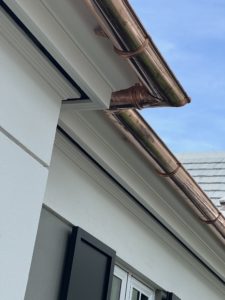 Seamless copper gutters on custom home build