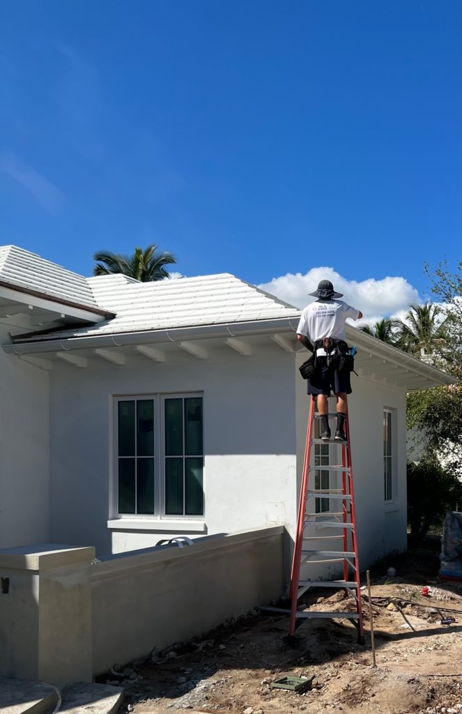 ALL PRO installing gutters on custom home builds